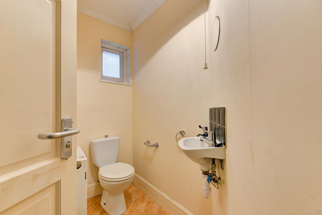 Well-maintained WC with modern fittings, compac...