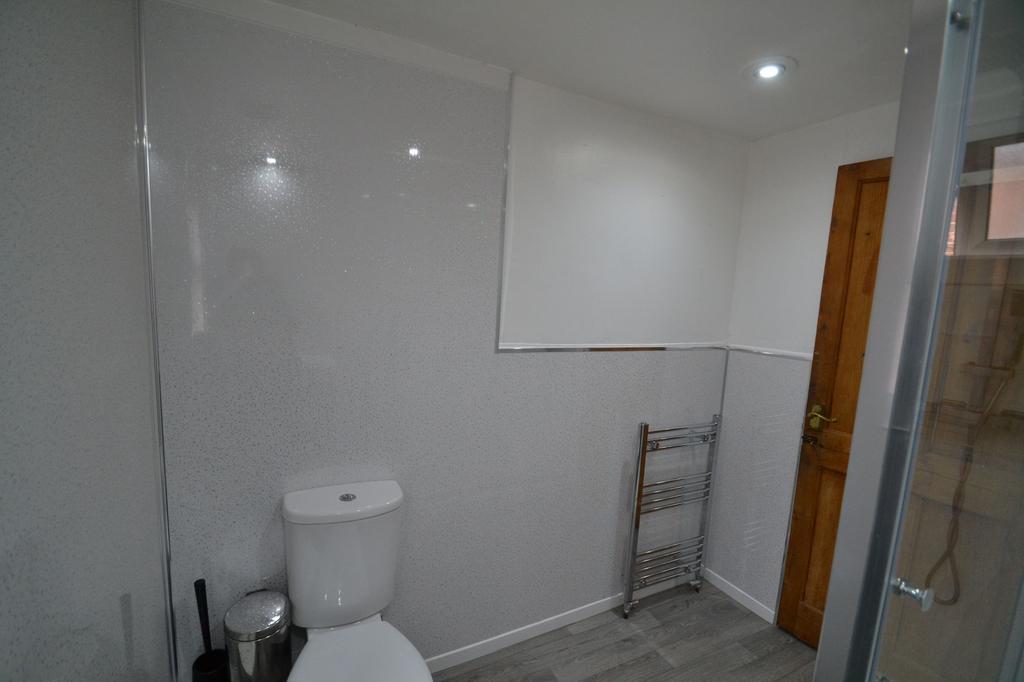 Clean and modern bathroom featuring a toilet, w...