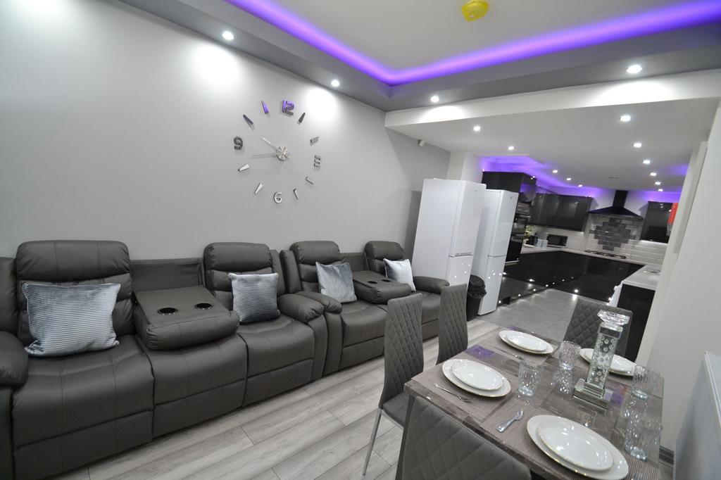 Bright and modern living room with stylish dark...