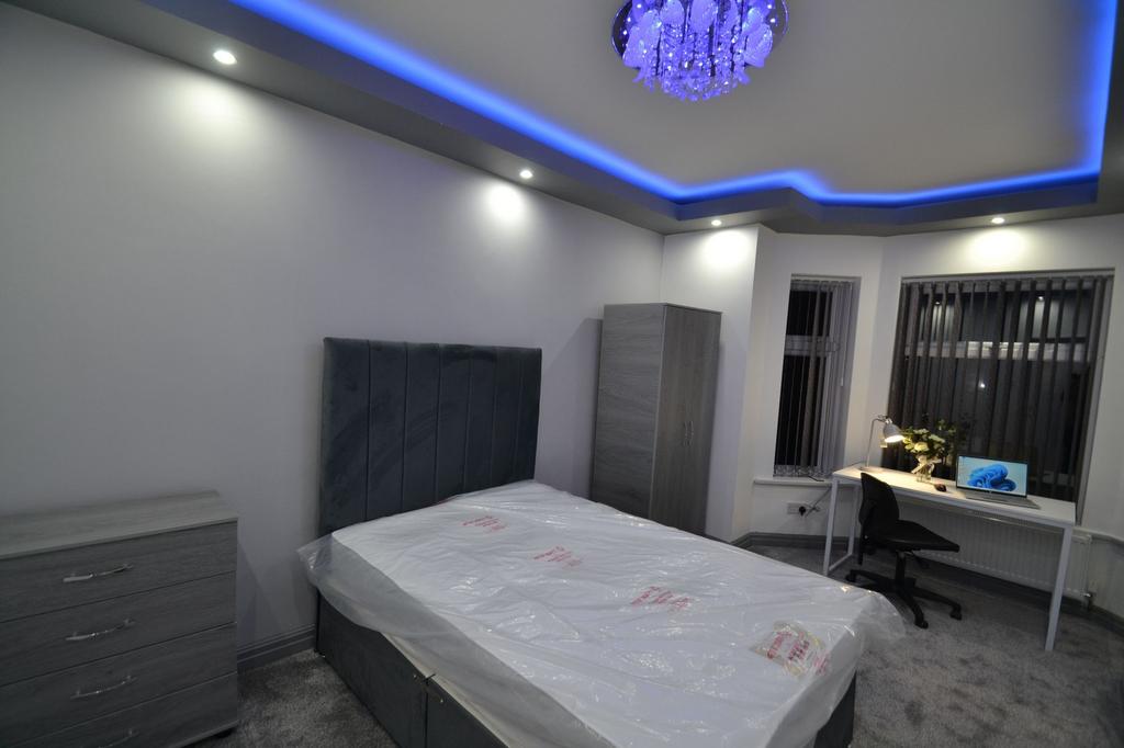 Modern and well-lit bedroom featuring a large d...