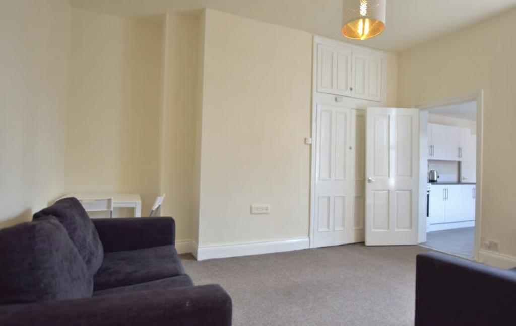 Bright, neutral living room with a comfortable ...