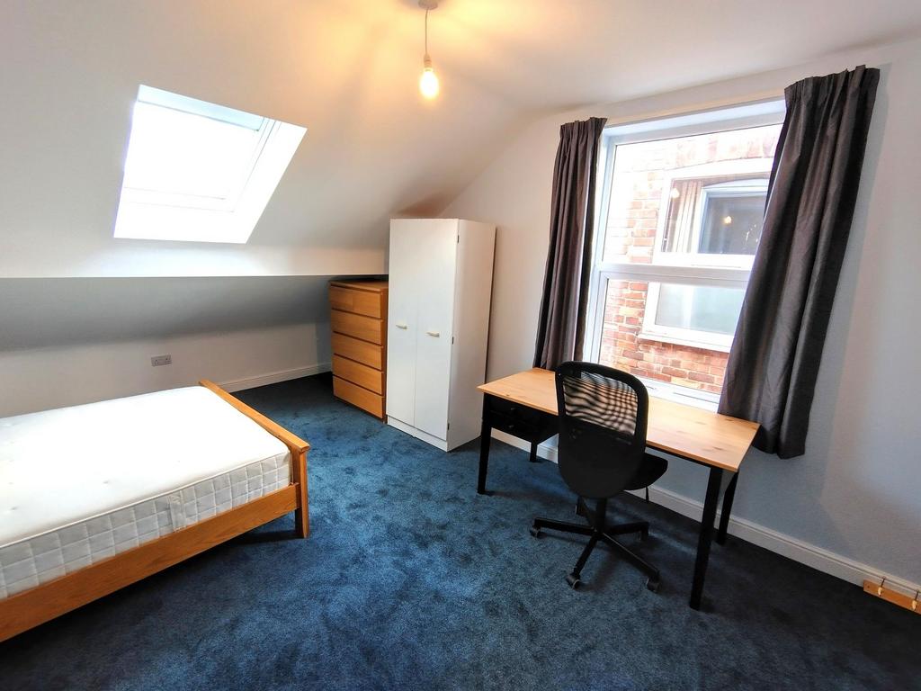 Bright, recently updated bedroom with a skyligh...