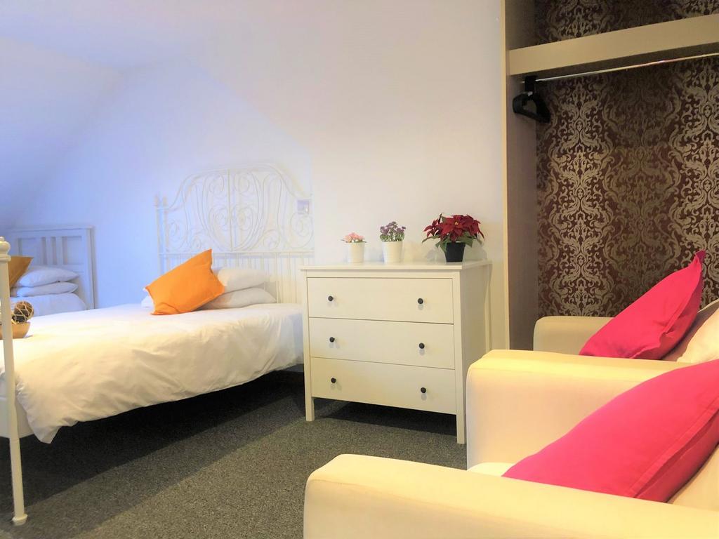 Bright and inviting double bedroom featuring a ...
