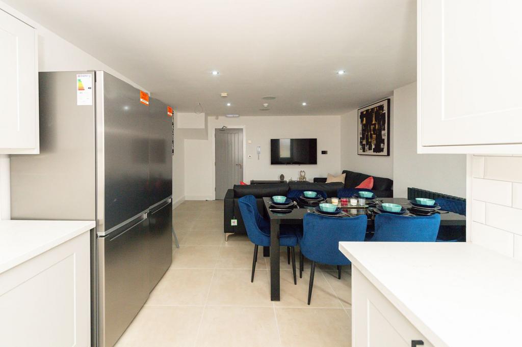 A spacious and modern living room featuring a l...