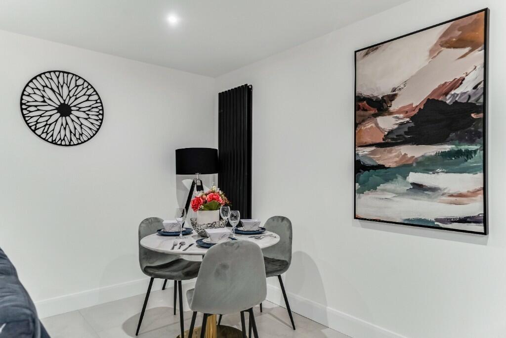 A modern and cozy living room featuring a styli...