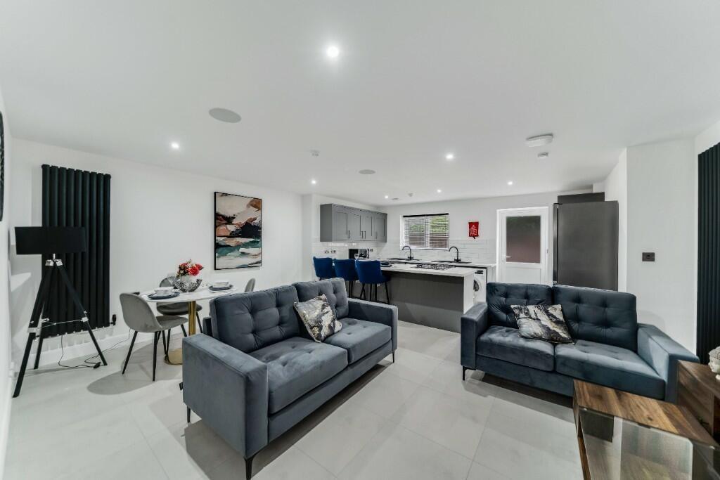 Spacious and modern living room with contempora...