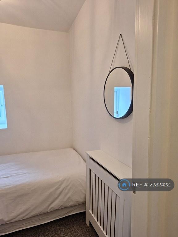 Small Bedroom With Hanging Mirror