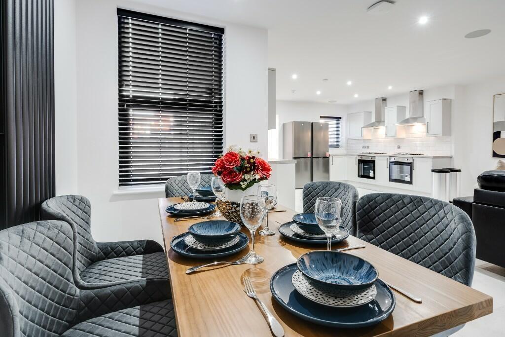 A modern and spacious living room featuring a s...