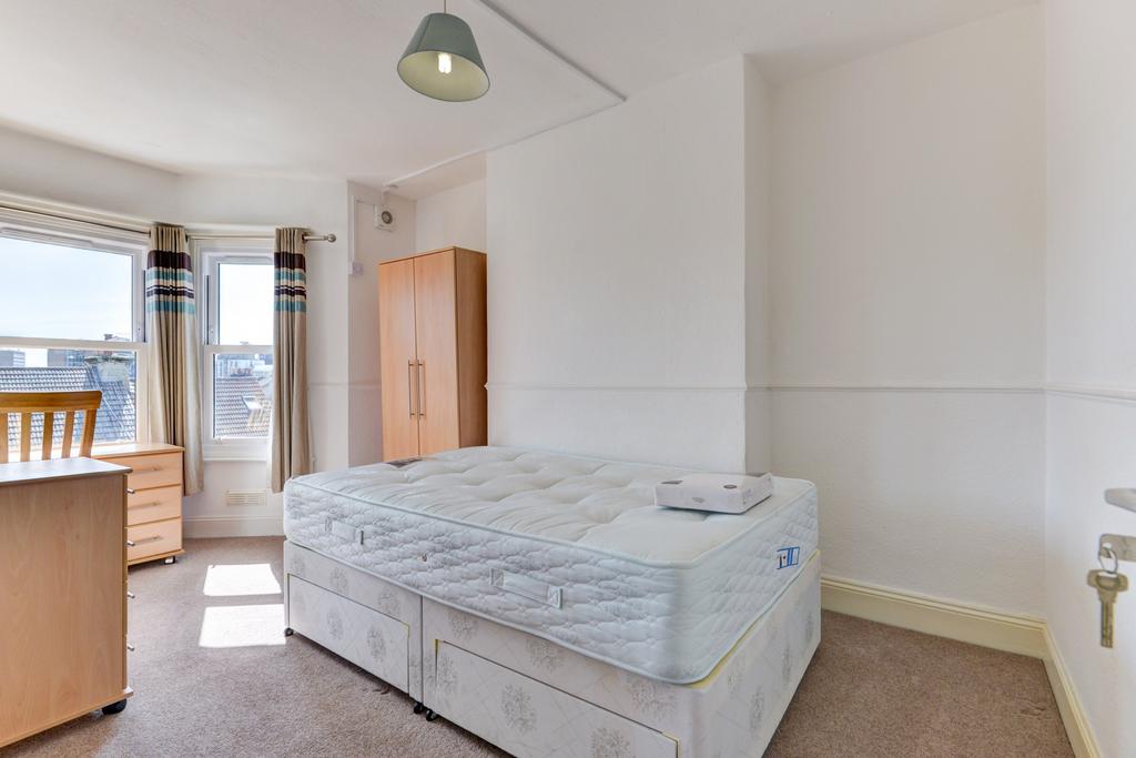 Bright and airy double bedroom featuring a comf...