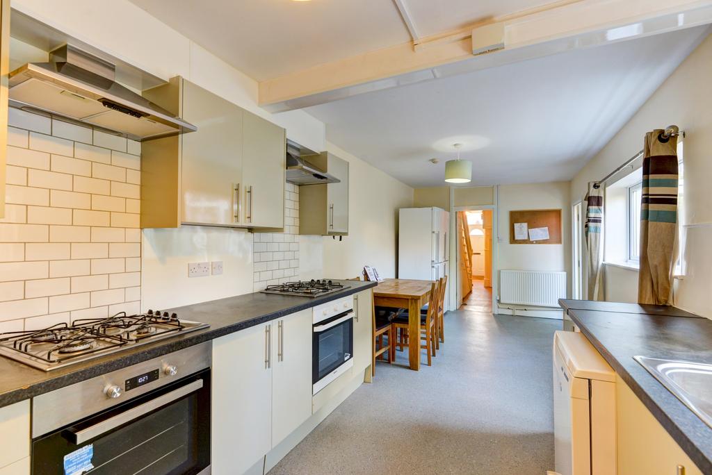 Bright and modern kitchen featuring a long coun...