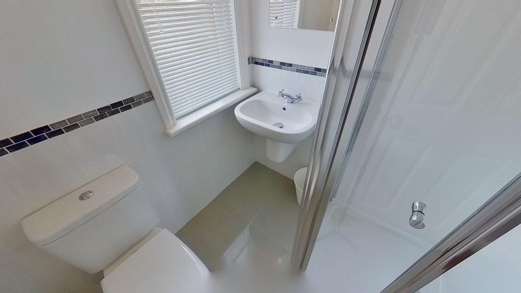 Bright, well-maintained bathroom with a modern ...