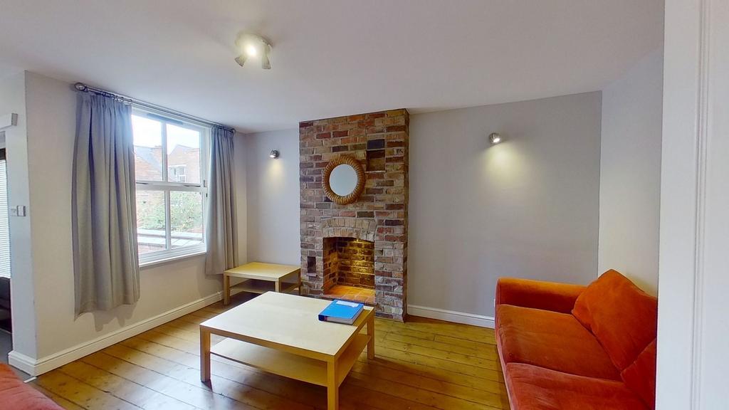 Bright, cosy living room with original wooden f...