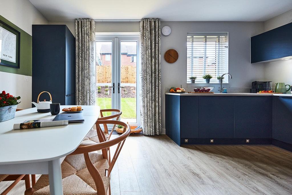 French doors open up to the rear garden,...