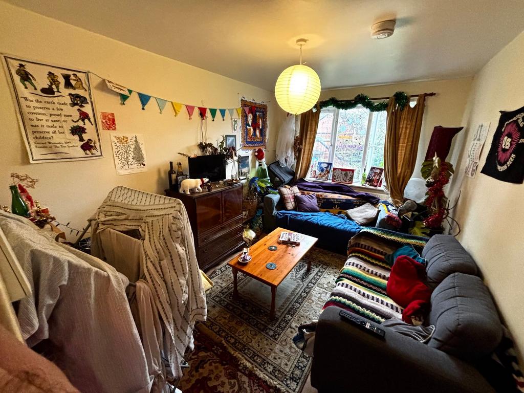 Bright, characterful living room with a large f...