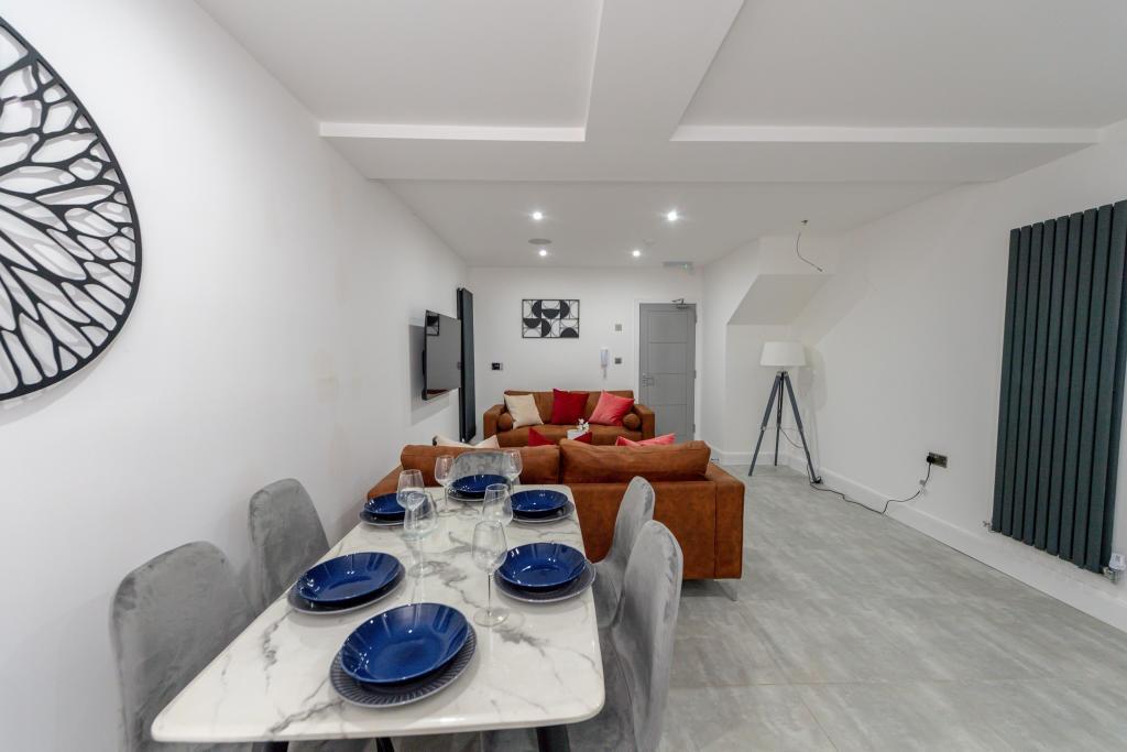 Bright and spacious living room featuring a mod...