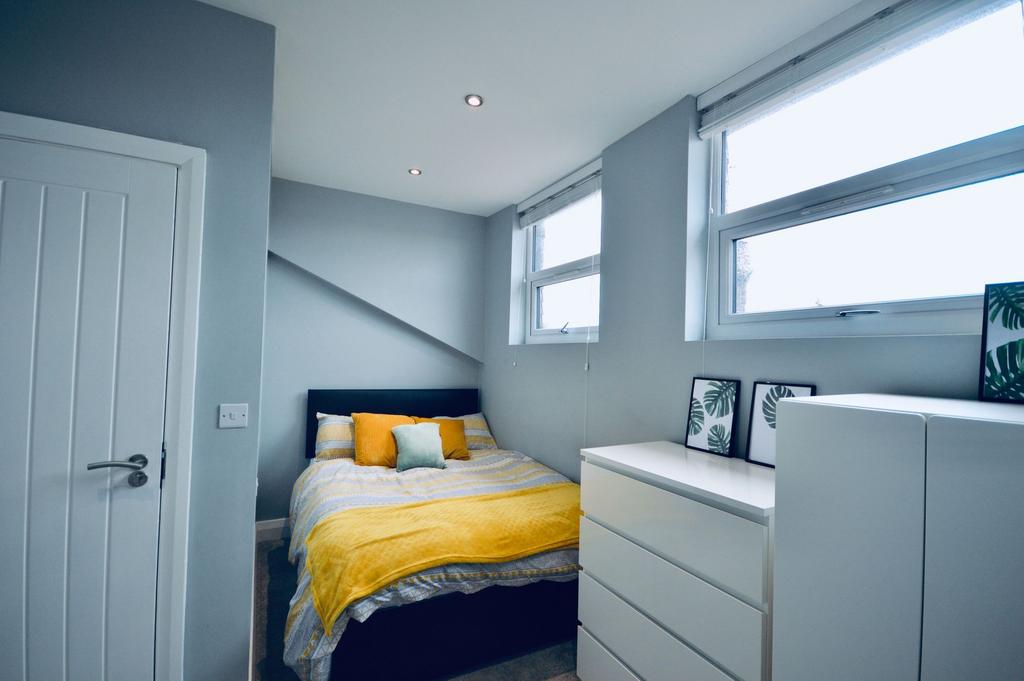 A modern, well-maintained bedroom featuring a l...