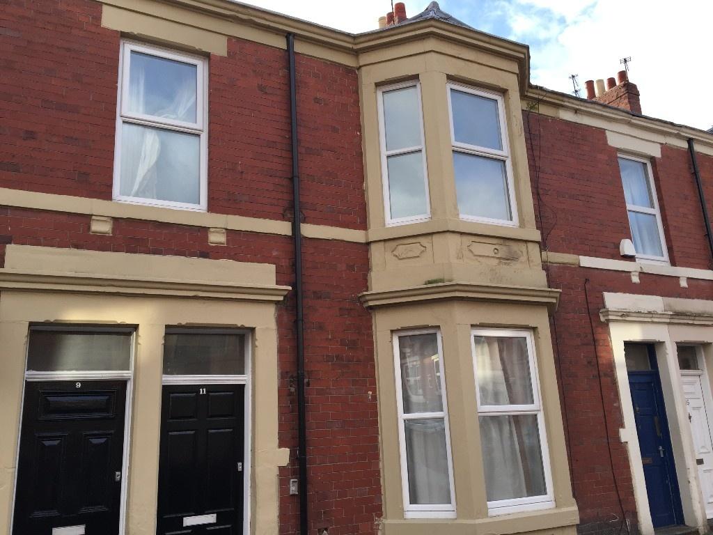 Traditional red-brick terraced property with ba...