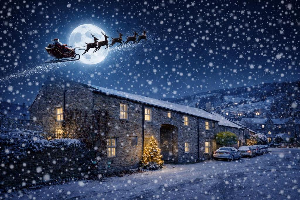 Santa flying over snowy village.png