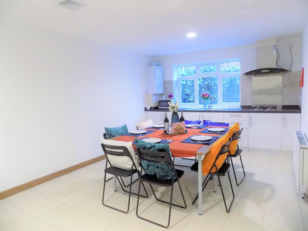 Bright, modern kitchen-diner with a large dinin...