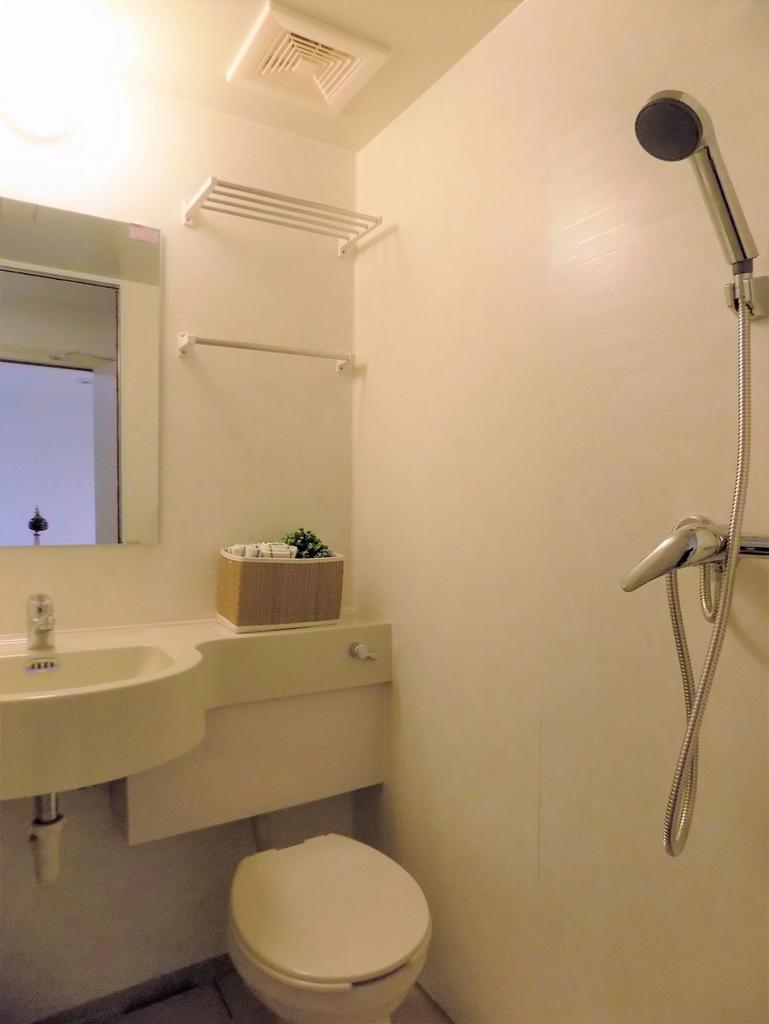 Compact, well-kept bathroom with a wall-mounted...