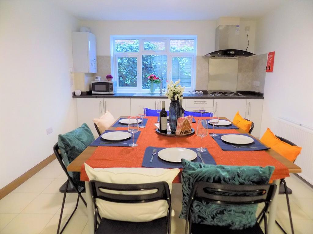 Bright, modern kitchen-diner with a large centr...