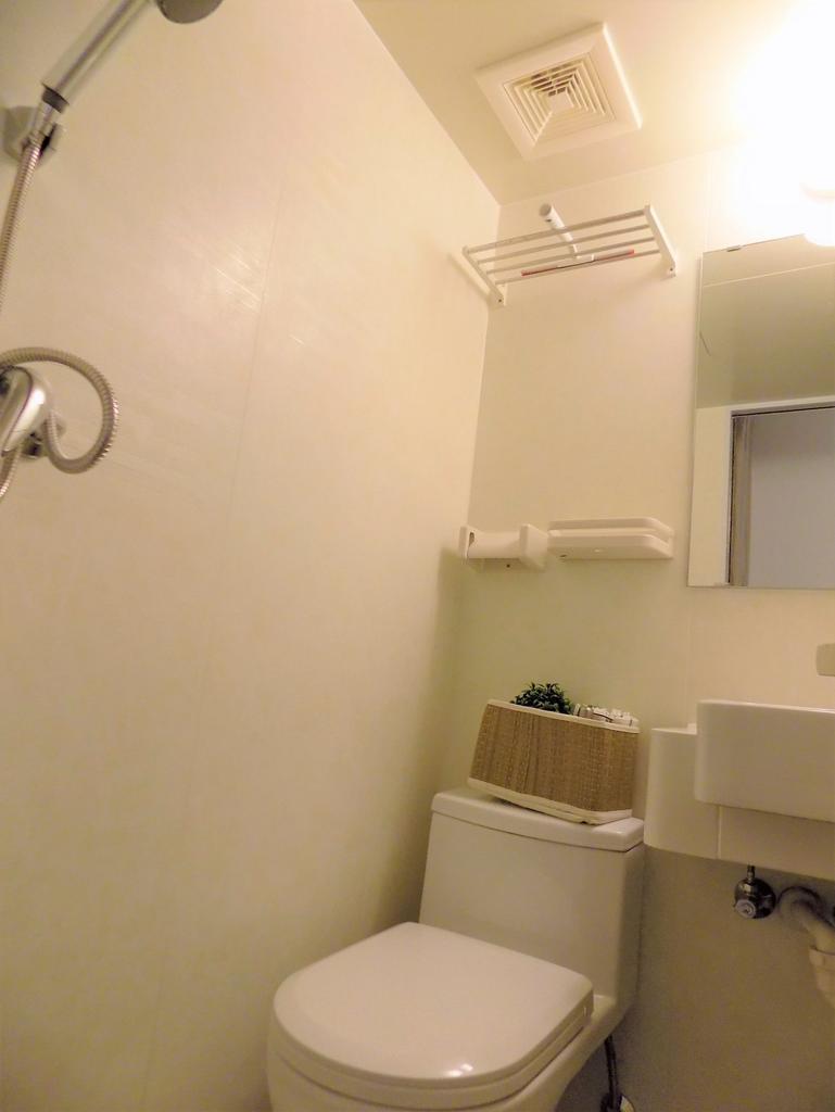 Neat, modern bathroom with a compact toilet and...