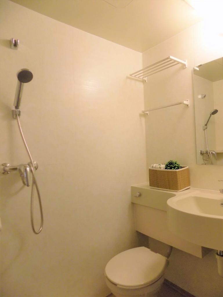 Compact, well-kept bathroom with a wall-mounted...