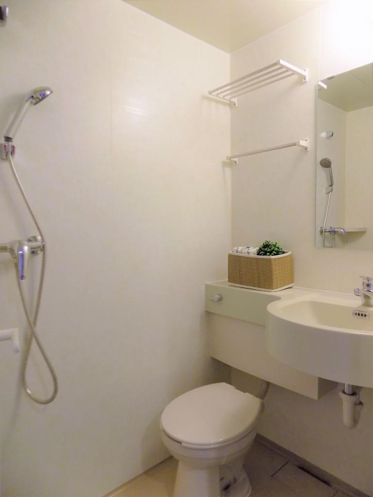 Compact, well-kept bathroom with a shower, wall...