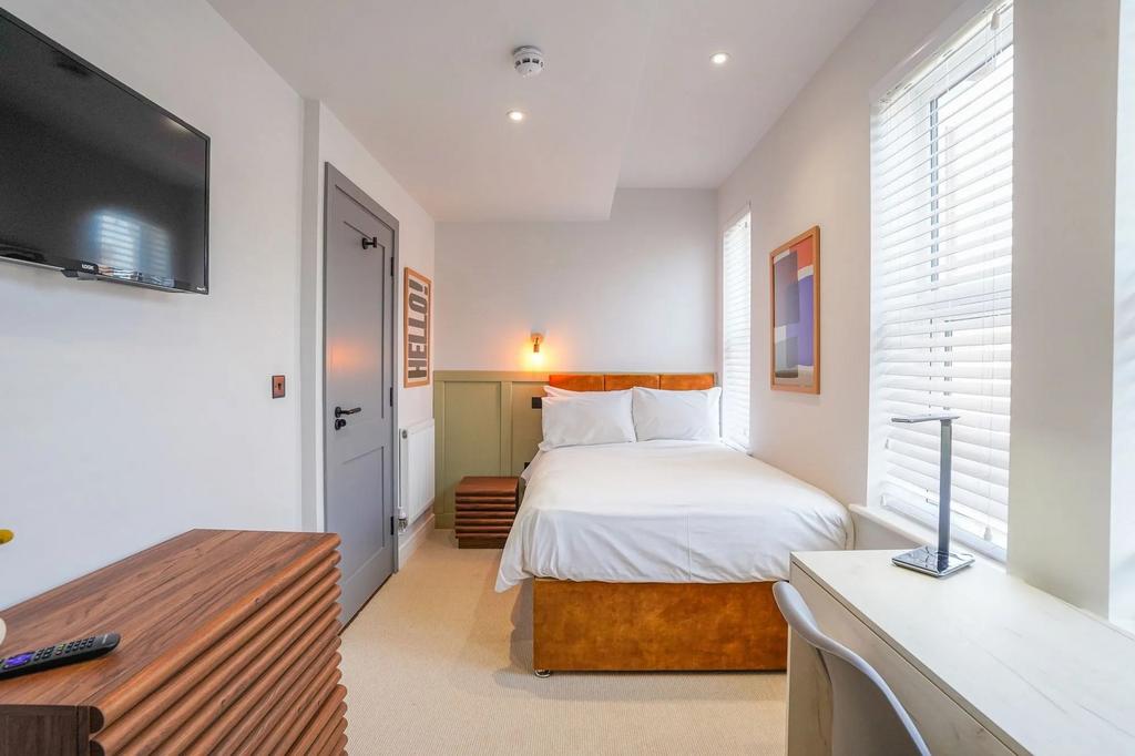 Bright and inviting master bedroom featuring a ...