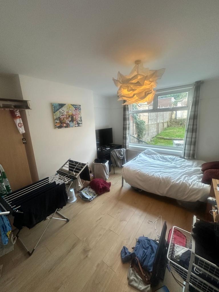 Bright bedroom with a large window overlooking ...