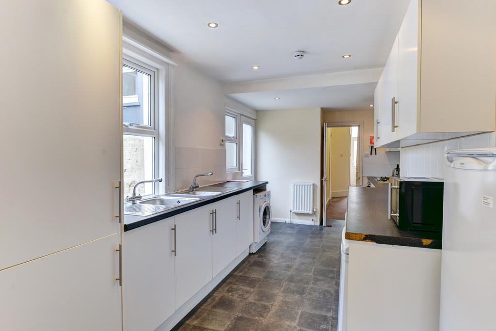 Bright and airy kitchen with ample counter spac...