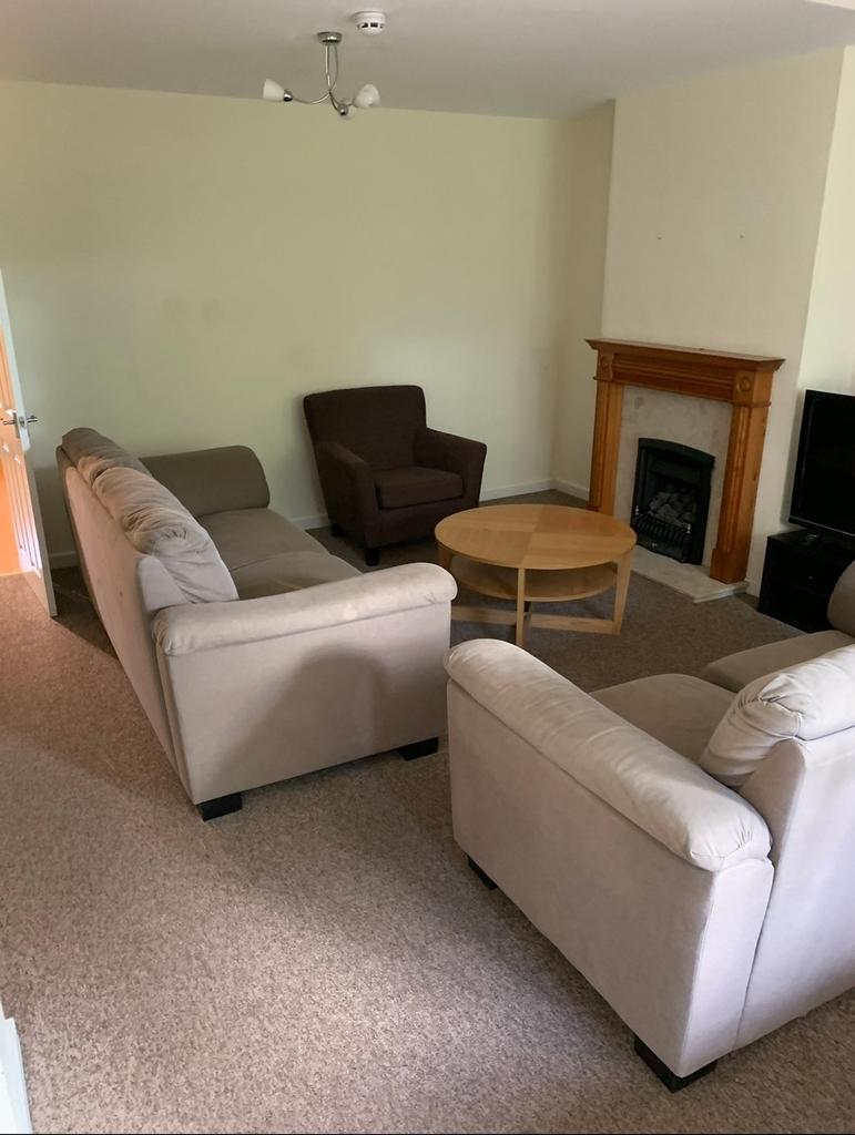 A cozy living room with comfortable seating, id...