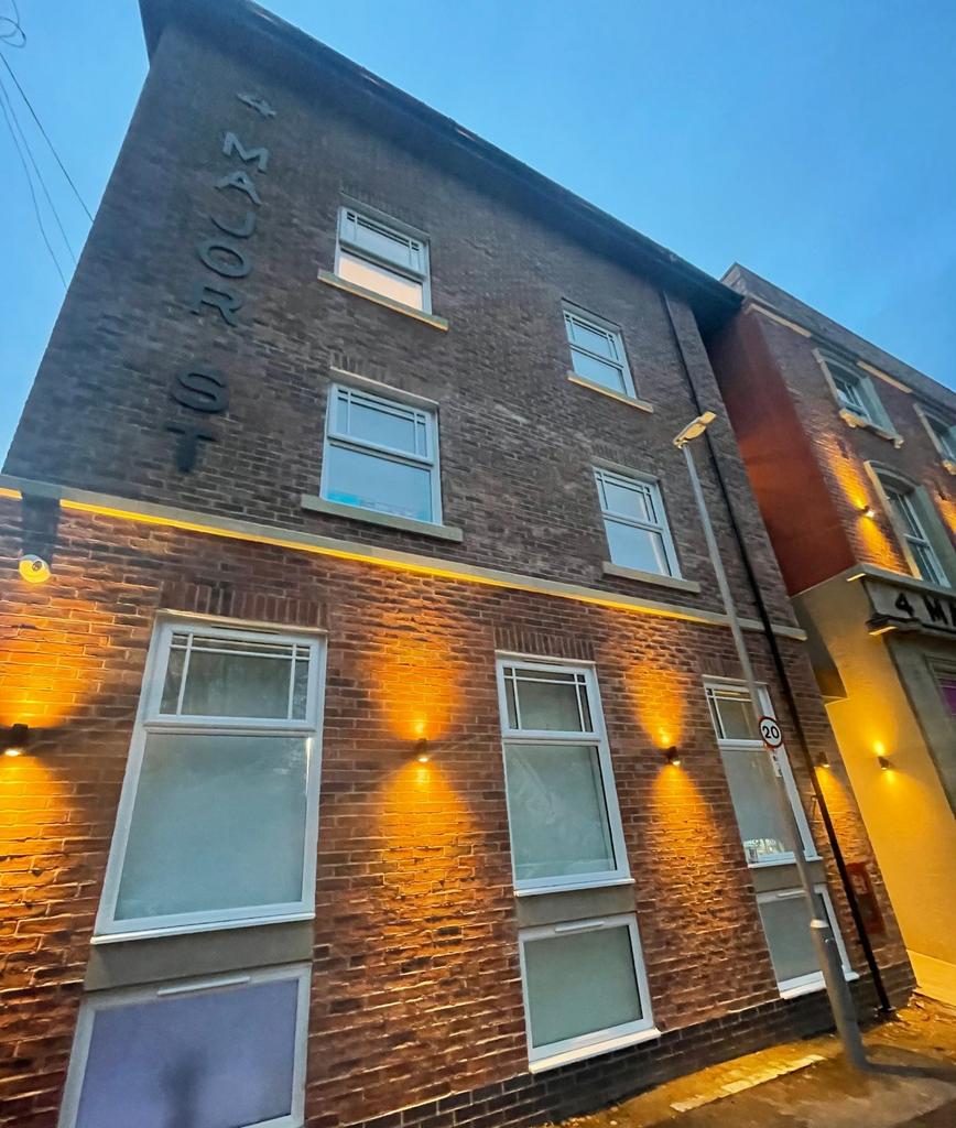 Attractive well-lit brick building frontage wit...