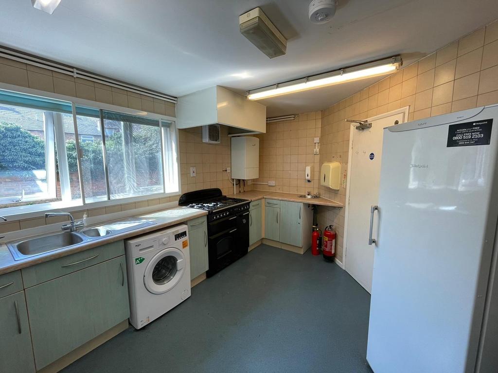 Bright and functional kitchen featuring ample c...