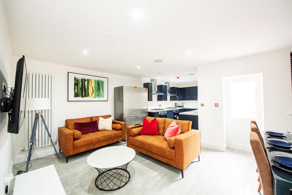 Bright and contemporary living room with two co...