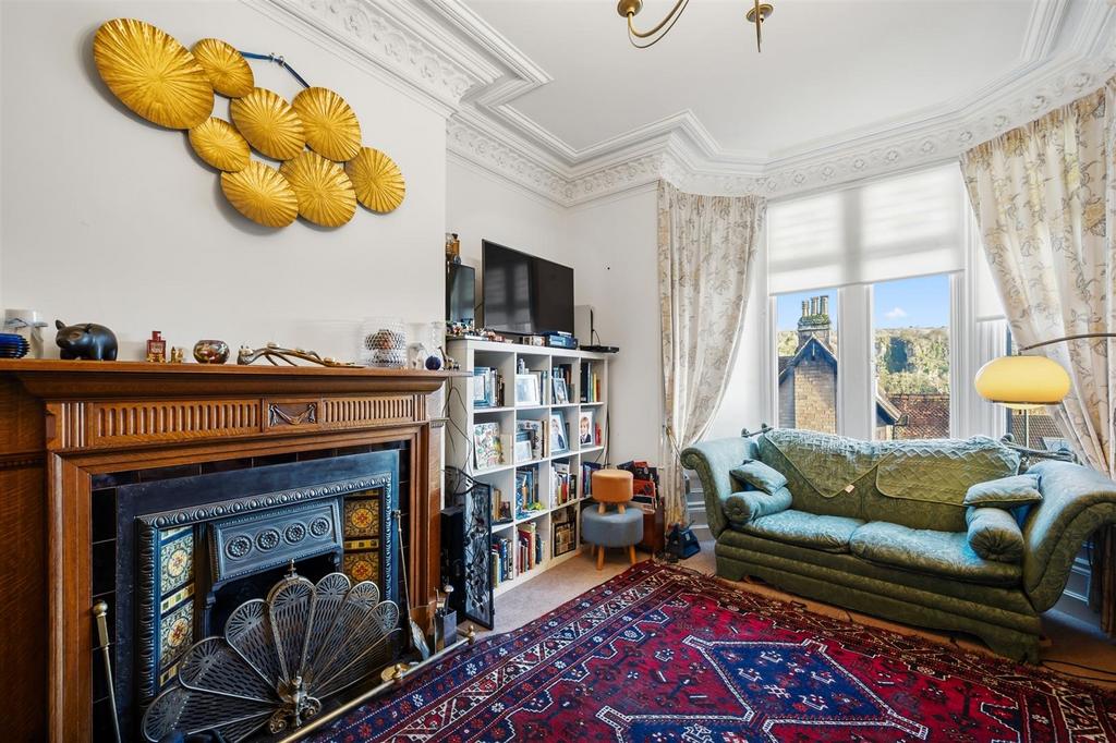 Sitting Room - fireplace and window.jpg