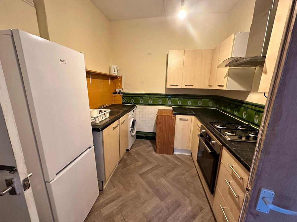 Well-equipped galley kitchen with integrated ov...