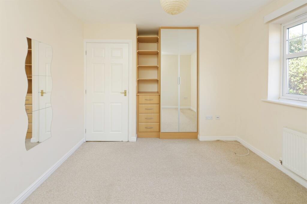 Bedroom One With Wardrobes