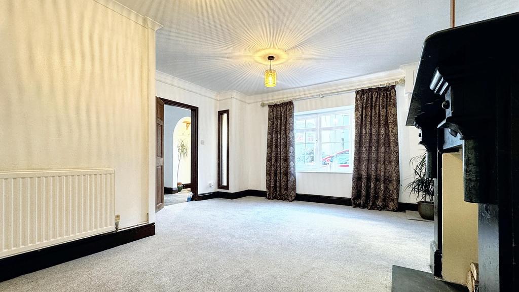 Spacious, bright living room with large windows...