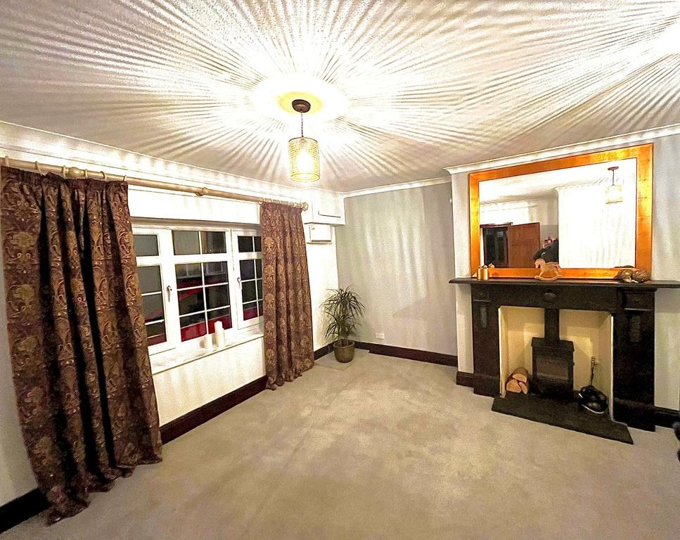 Well-presented living room with a decorative ce...
