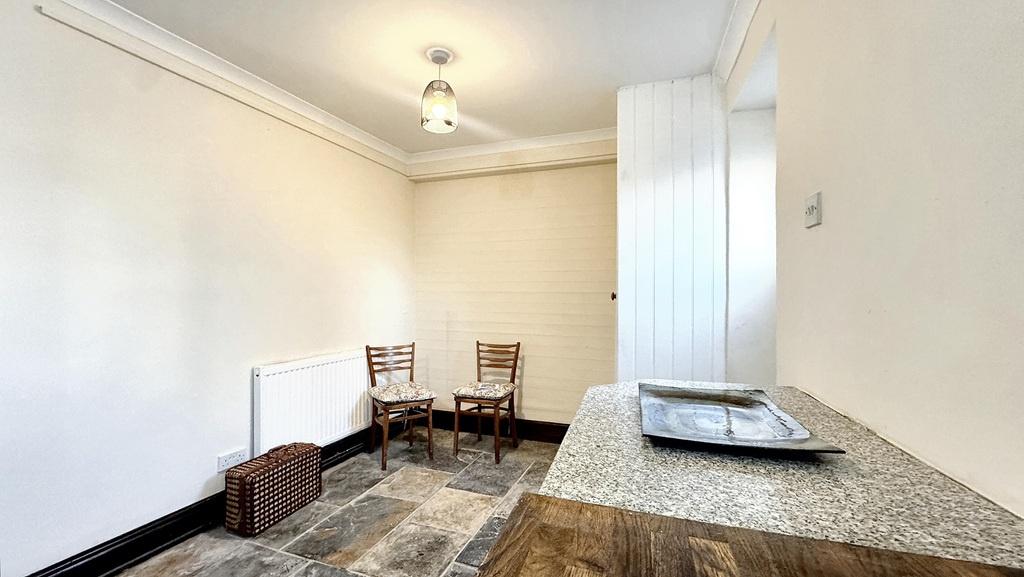 Bright, neutral living area with high ceilings,...