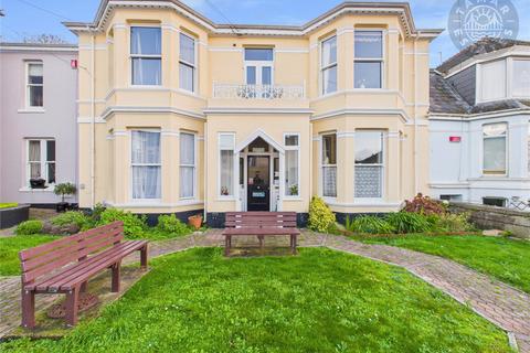 'Start your day above the city, coffee in hand, from this top floor balcony apartment'