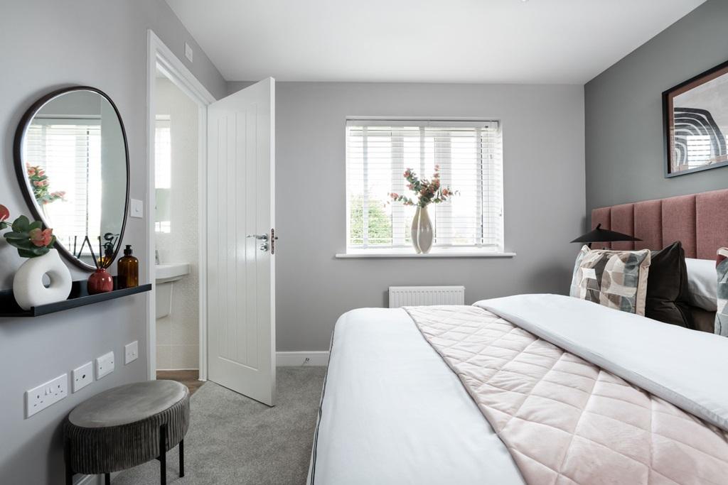 The luxurious main bedroom with en suite shower...