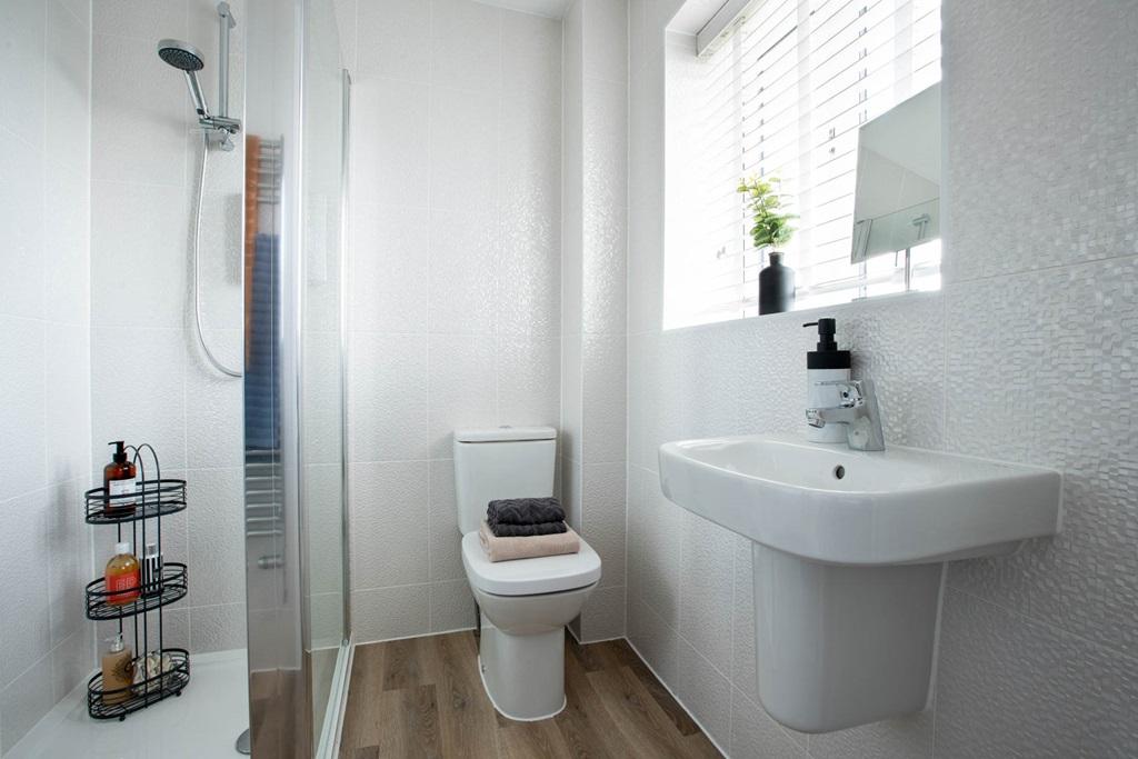 The master bedroom includes an en suite, a...