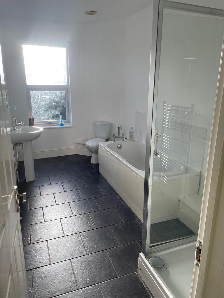 Bright, modern bathroom with a separate shower ...