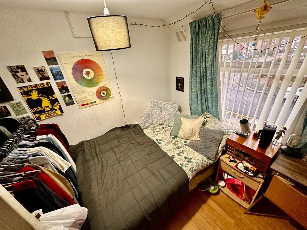 Cozy furnished bedroom with a comfortable bed, ...
