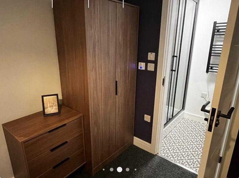 Well-presented bedroom corner with coordinated ...