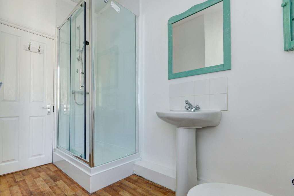 Bright, modern bathroom with a walk-in shower, ...