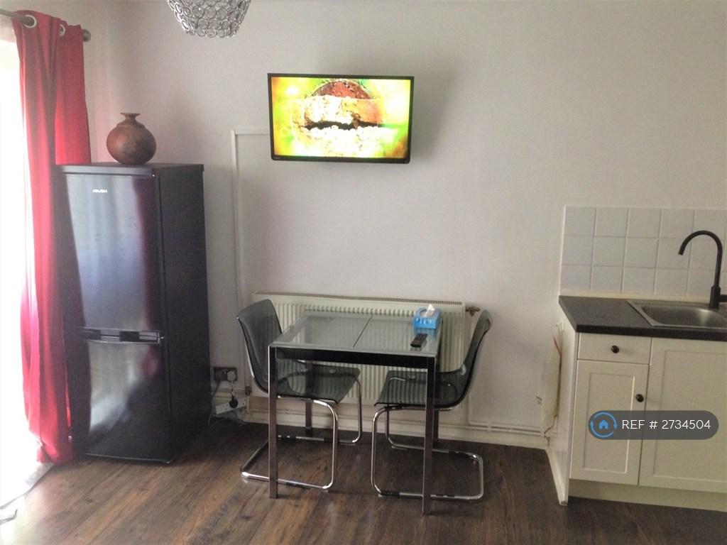 Tv Mounted On Wall Over Dining Table
