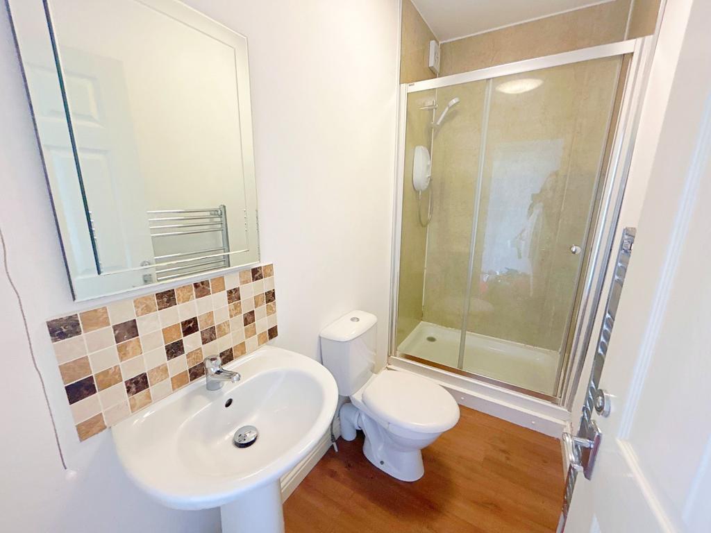 A clean and modern bathroom featuring a spaciou...
